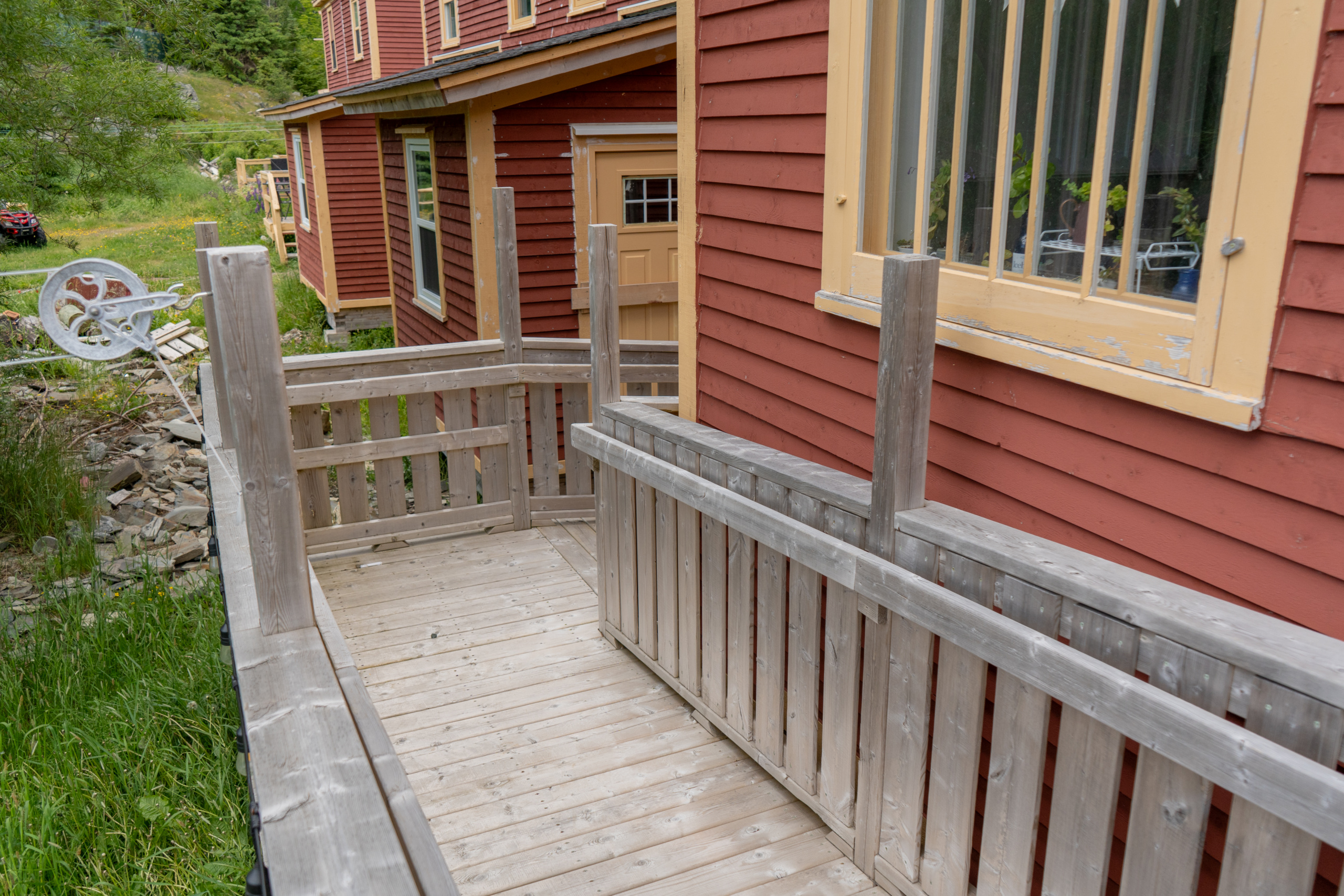 The wheelchair ramp viewed backwards from the top of it.