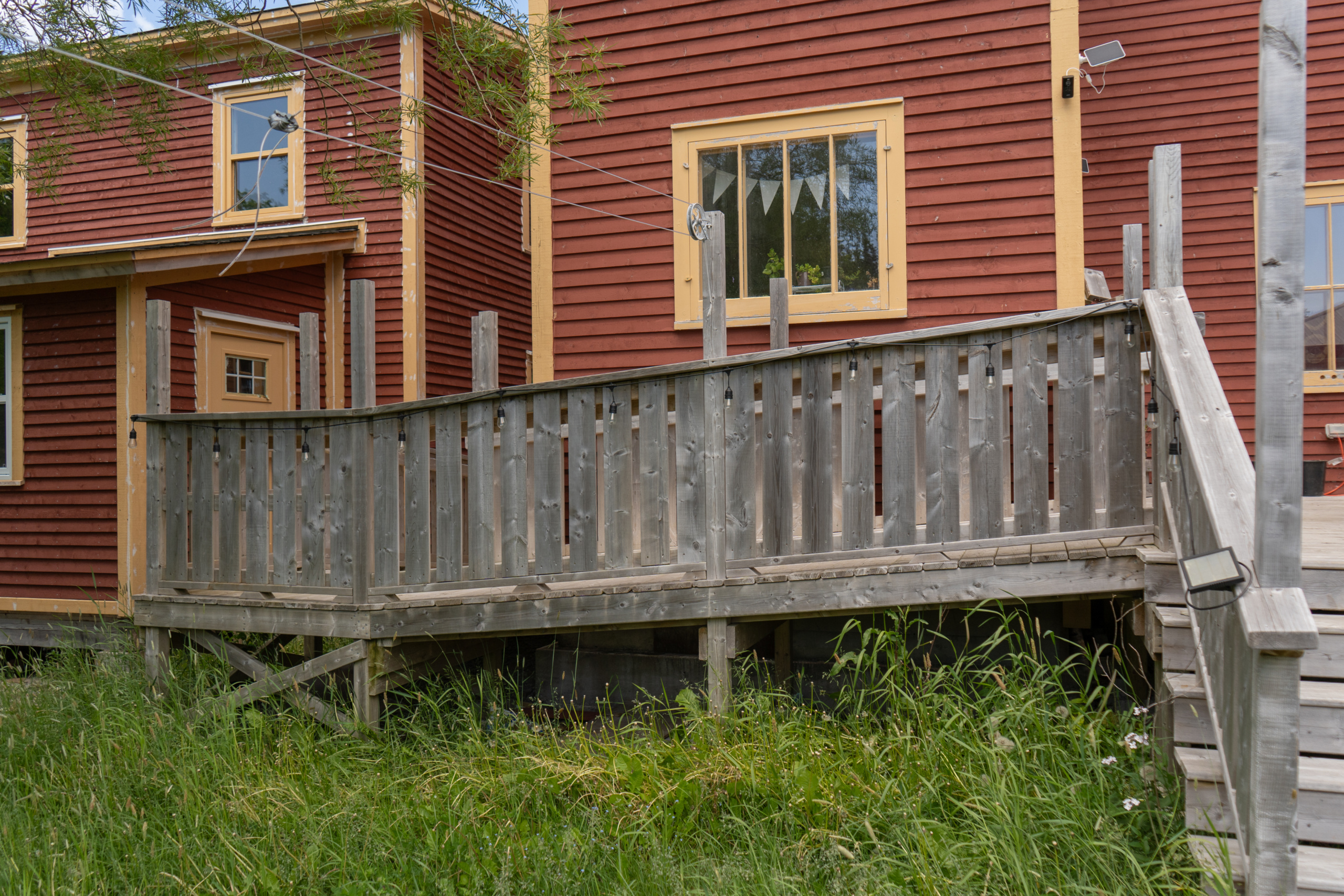 The wheelchair ramp incline leading to the patio, viewed from the garden.